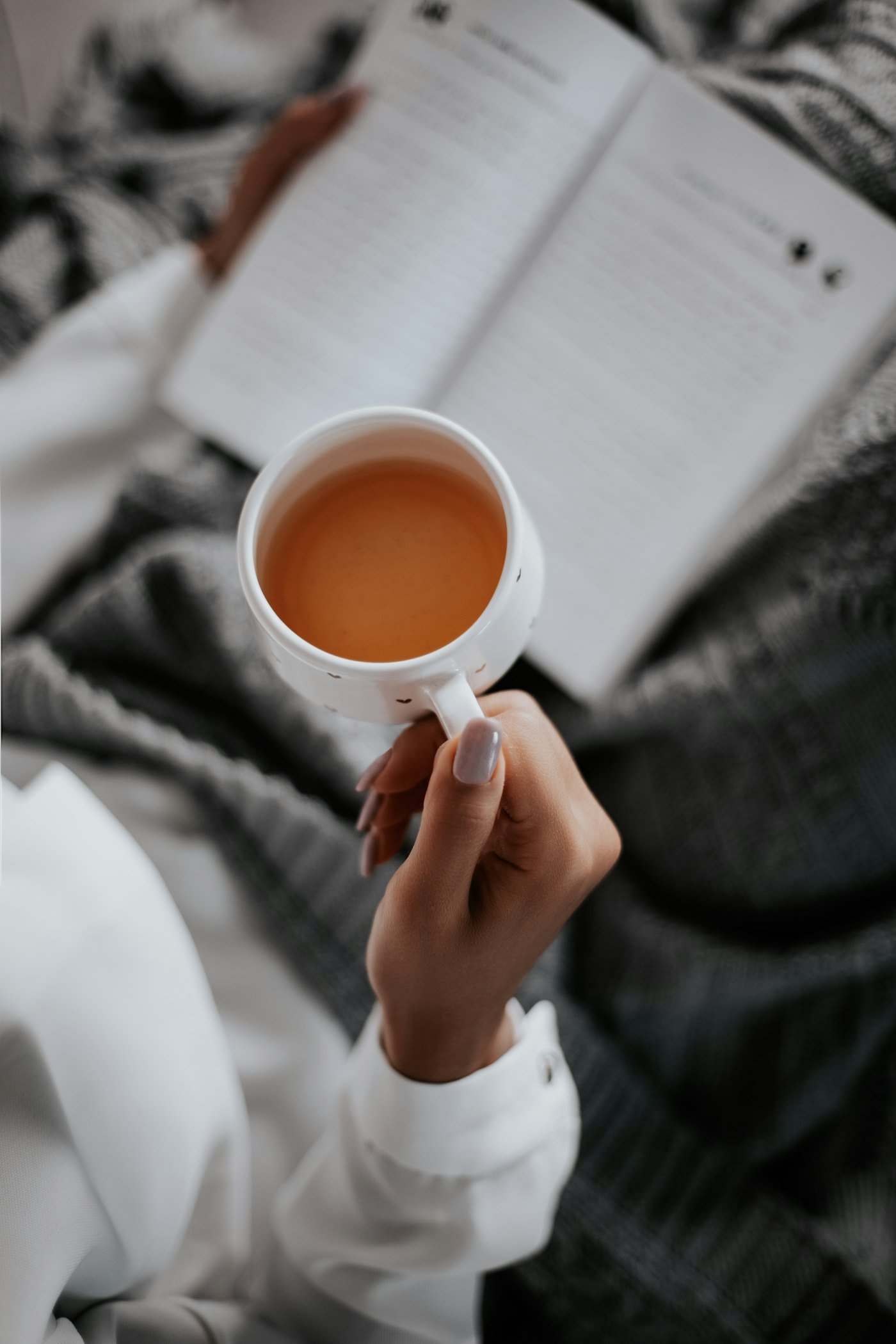 Hands holding a cup of tea
